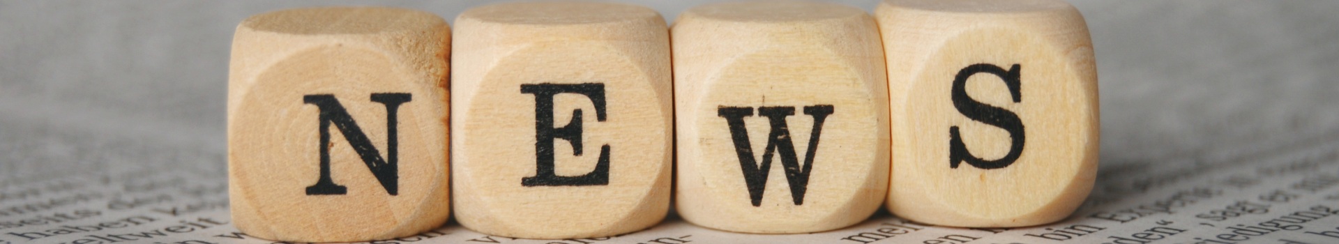 News written with lettered dice